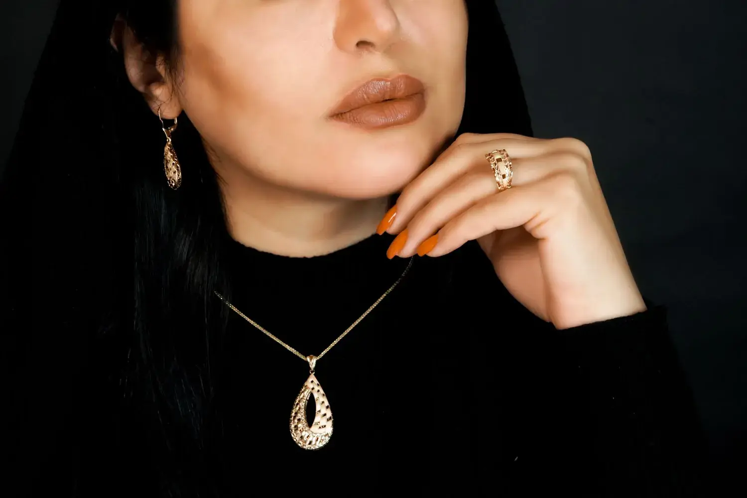 A necklace, a ring, and the shoulder they were drawn for